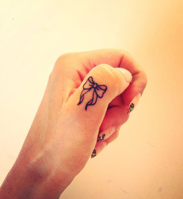 small cute finger tattoo design 