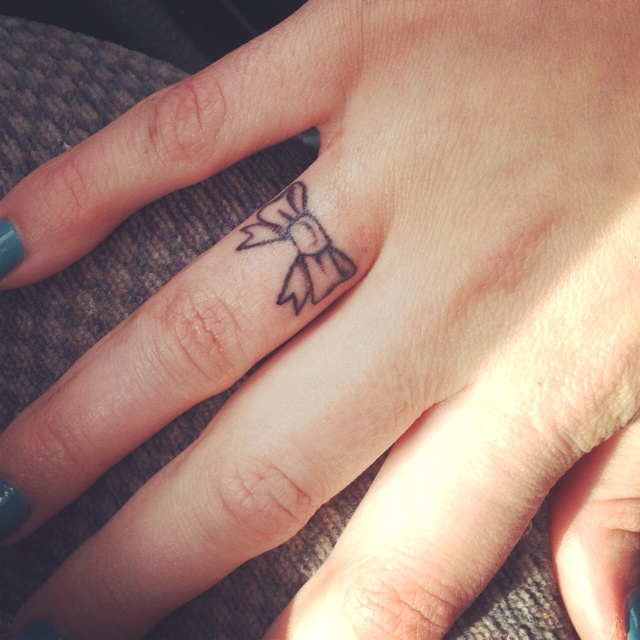 cute finger tattoo design 