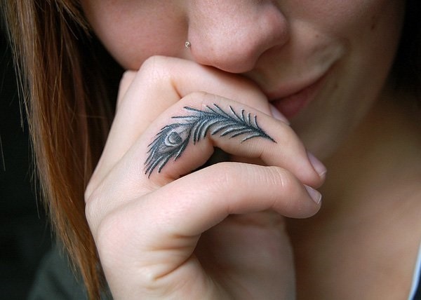female finger tattoo 