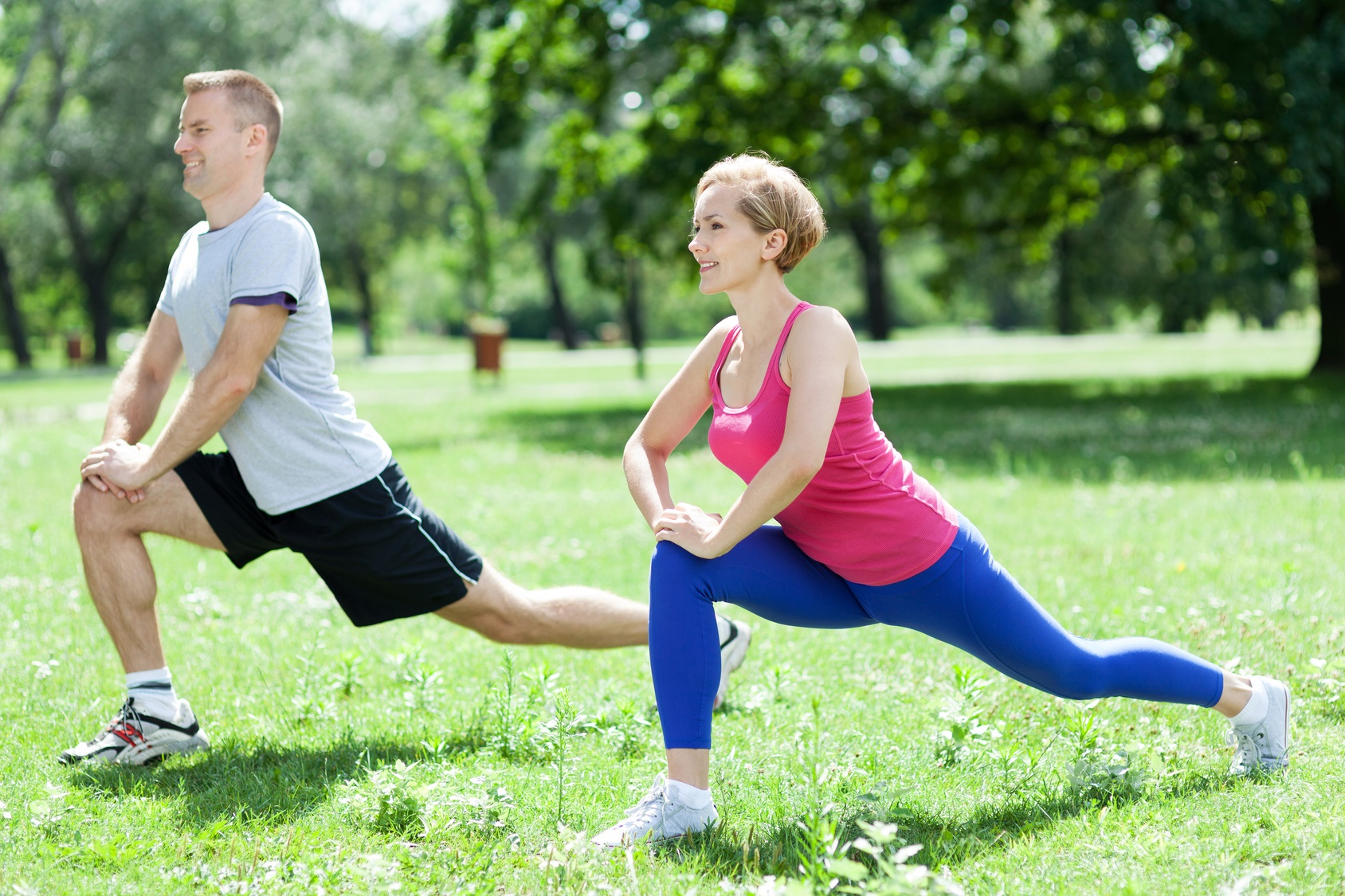 Man and woman doing stretching exercises